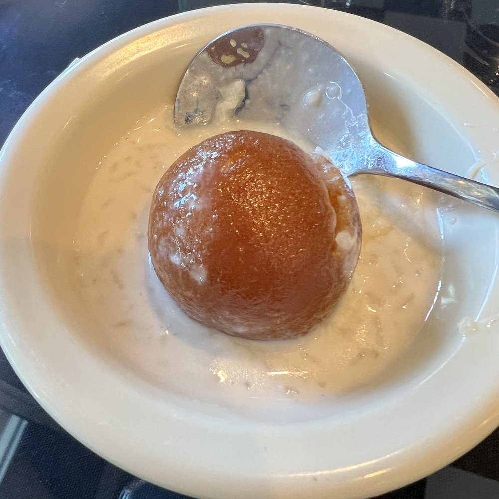 Wok India Restaurant and Bar - Nice m, surprise treat at the end of the meal. Very good rice pudding with mango cake ball. - Indian Near Me - Mason, Ohio