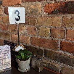 IRONWORKS kitchen - Industrial decor; lovely exposed brick walls.