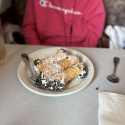 Stephen Anthony's Restaurant - Chris Pakus enjoying a cannoli at Steven and Anthony's!