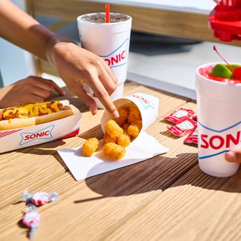 Sonic Drive-In - a person eating a hot dog - Fast Food Near Me - Jackson, Mississippi