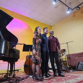 An Die Musik - a group of people standing in front of a piano - Jazz & Blues Near Me - Baltimore, Maryland An Die Musik - a group of people standing in front of a piano - Jazz & Blues Near Me - Baltimore, Maryland