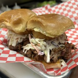 Sliders Sports Pub - BBQ pulled pork slider topped with coleslaw and an onion ring
