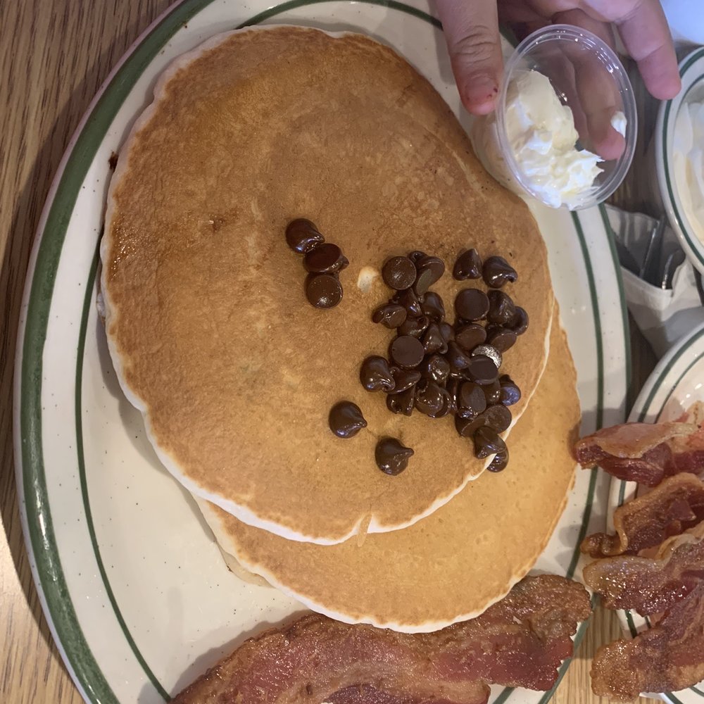 Penfold's Cafe & Bakery - Chocolate chip pancakes with a side of bacon - Breakfast & Brunch Near Me - Temecula, California Penfold's Cafe & Bakery - Chocolate chip pancakes with a side of bacon - Breakfast & Brunch Near Me - Temecula, California