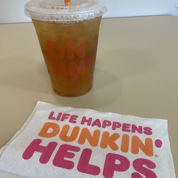 Dunkin' -  a drink and a napkin with the words life happens dunkin helps - Coffee & Tea Near Me - Green Bay, Wisconsin
