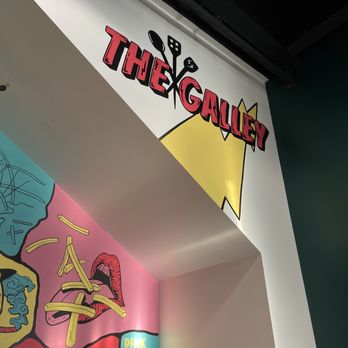 Galley On The Levee - a mural of a cartoon character - Food Court Near Me - Newport, Kentucky
