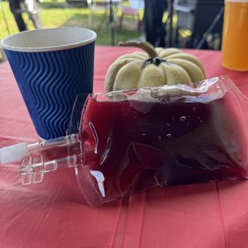 Weathered Vineyards - a bag of blood and a cup of juice on a table - Wineries Near Me - New Tripoli, Pennsylvania Weathered Vineyards - a bag of blood and a cup of juice on a table - Wineries Near Me - New Tripoli, Pennsylvania