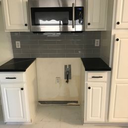 Custom quartz cuts for stove side cabinets and stove backsplash