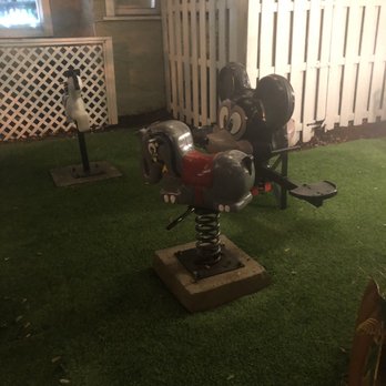 Dada - The metal spring horse with cement base and screws that were drilled into nothing. - New American Near Me - Delray Beach, Florida Dada - The metal spring horse with cement base and screws that were drilled into nothing. - New American Near Me - Delray Beach, Florida