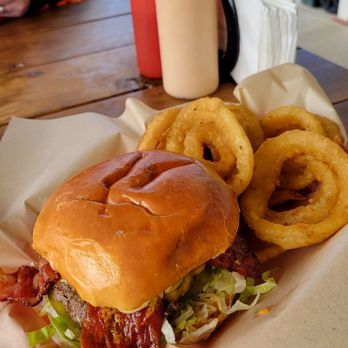 The Burger Joint - Jalapeño bacon burger with tasty onion rings. - Burgers Near Me - Parma, Idaho The Burger Joint - Jalapeño bacon burger with tasty onion rings. - Burgers Near Me - Parma, Idaho