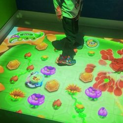 Bucketz Game Zone - A small room with an interactive light display