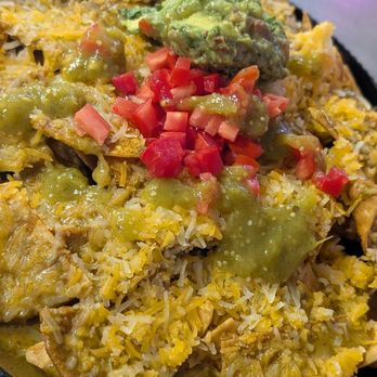 Curry Cantina - Masala Nachos w/added tomato's, guacamole and salsa verde. - Indian Near Me - Selma, California