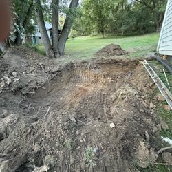 31 East Landscaping and Excavation - This is the gaping hole that sits at the side of my house.