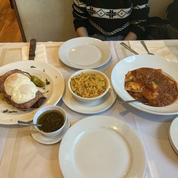 Tango Argentinian Steakhouse - Very Tasty! 20 oz Shell Steak W/Ham, Red Peppers, & fried eggs with a side of rice. Cheese Ravioli / Ravioles De Queso - Steakhouses Near Me - Central Islip, New York