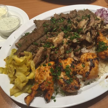 Maan's Mediterranean Grill - The Two People plate. We got the kabobs, chicken shawarma and chicken kabobs. Also comes with 2 salads and hummus n pita bread. So good!!! - Mediterranean Near Me - Oceanside, California