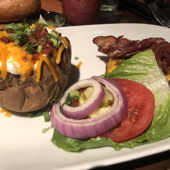 LongHorn Steakhouse - Loaded baked potato and fresh fixings and bacon cheeseburger. - Steakhouses Near Me - Williston, Vermont