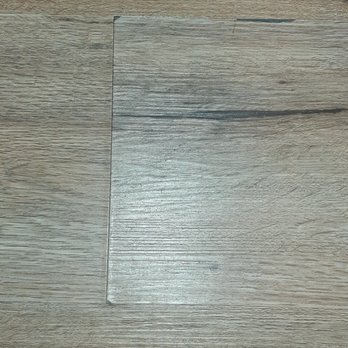 S & S Construction Restoration, Inc - This one in the kitchen is seperating and warping and peeling while some are smashed together causing a crease - General Contractors Near Me - Apple Valley, California