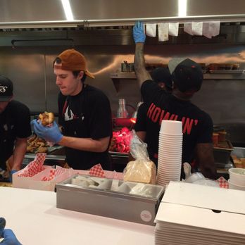 Howlin' Ray's - Open cook line on the other side of the small customer counter - Southern Near Me - Los Angeles, California Howlin' Ray's - Open cook line on the other side of the small customer counter - Southern Near Me - Los Angeles, California