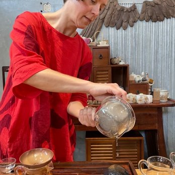 Fox and Moon Tearoom - a woman pouring tea - Tea Rooms Near Me - Los Angeles, California Fox and Moon Tearoom - a woman pouring tea - Tea Rooms Near Me - Los Angeles, California