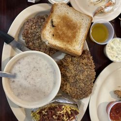 Street's Seafood Restaurant - Country Fried Steak and a Loaded Baked Potato with white gravy on the side.