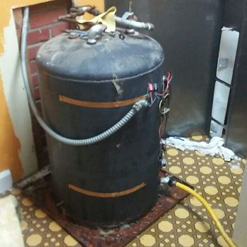 DripDrop - An old cast iron hot water heater - Plumbing Near Me DripDrop - An old cast iron hot water heater - Plumbing Near Me