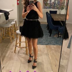 Alice And Olivia - Feathered skirt, scoop back blouse and studded belt.