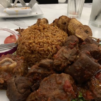 Aria Suya Kitchen - Asun Plate with Jollof and Plantain Plate Goat meat - African Near Me - Houston, Texas Aria Suya Kitchen - Asun Plate with Jollof and Plantain Plate Goat meat - African Near Me - Houston, Texas