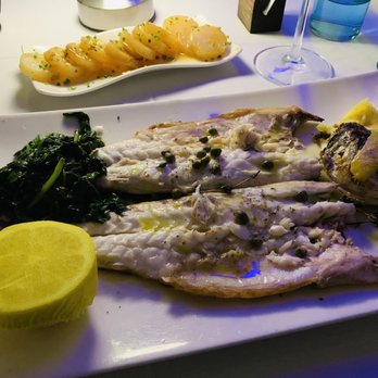 Nerai - Bronzino dish with sautéed lemon spinach -- EXCELLENT! Lemon Potatoes behind that, yummm! - Greek Near Me - New York, New York Nerai - Bronzino dish with sautéed lemon spinach -- EXCELLENT! Lemon Potatoes behind that, yummm! - Greek Near Me - New York, New York