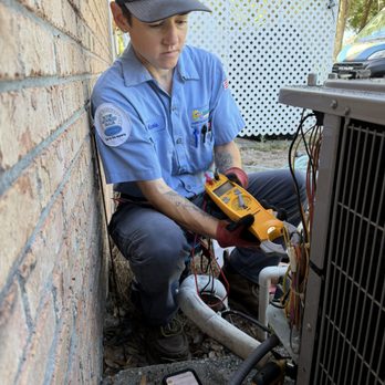 Sunshine Air Conditioning, Inc - HVAC Tech performing regular maintenance. - Heating & Air Conditioning/HVAC Near Me - Belleview, Florida Sunshine Air Conditioning, Inc - HVAC Tech performing regular maintenance. - Heating & Air Conditioning/HVAC Near Me - Belleview, Florida