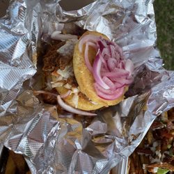 Hotty's Eats and Catering - Messy BBQ pulled pork on a cornbread roll