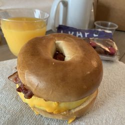 The Paddock Grill - Bagel breakfast sandwich with bacon, cheese and egg