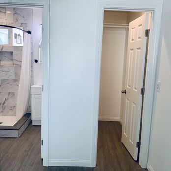 All - Conditions Construction - a view of a bathroom from the hallway - General Contractors Near Me All - Conditions Construction - a view of a bathroom from the hallway - General Contractors Near Me