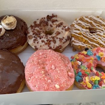 OMG Donuts & Bakery - some amazing donuts: (top) s'mores, maple bacon, pumpkin crumble, (bottom) Bavarian creme, strawberry with raspberry filling, fruity pebbles - Donuts Near Me - Concord, North Carolina OMG Donuts & Bakery - some amazing donuts: (top) s'mores, maple bacon, pumpkin crumble, (bottom) Bavarian creme, strawberry with raspberry filling, fruity pebbles - Donuts Near Me - Concord, North Carolina