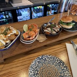 Delicatessen - TAPAS Potatoes; garlic chili shrimp; artichokes; burger