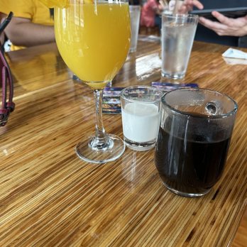 The Social Bar + Kitchen - Classic mimosa (left) and coffee with cream on the side (right) - New American Near Me - New London, Connecticut The Social Bar + Kitchen - Classic mimosa (left) and coffee with cream on the side (right) - New American Near Me - New London, Connecticut
