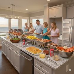 Outer Banks Clam Bakes - Fresh seafood being poured straight from the pot! Our signature Low Country Boil in action. Outer Banks Cooking brings the kitchen to your b