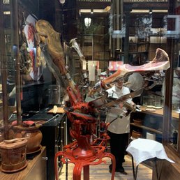 Rotating ham leg machine used to create different cuts of meat with different flavors.