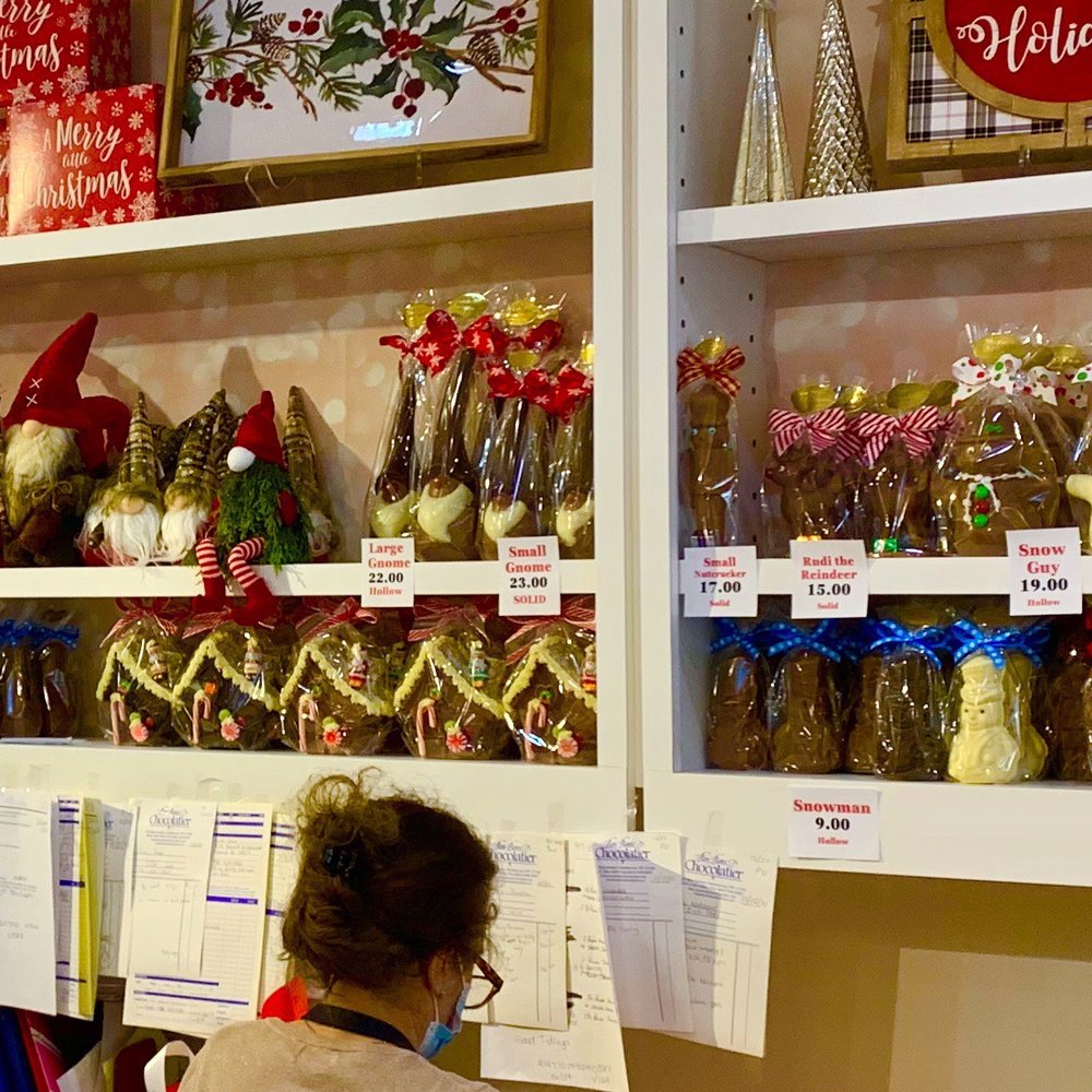 Bon Bons Chocolatier - a woman at a counter - Candy Stores Near Me - Huntington, New York