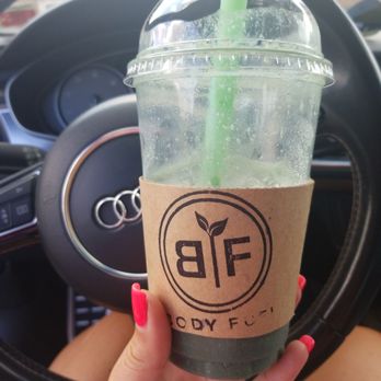 Body Fuel - a hand holding a cup of coffee - Juice Bars & Smoothies Near Me - Webster, New York Body Fuel - a hand holding a cup of coffee - Juice Bars & Smoothies Near Me - Webster, New York