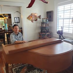 Malicki Piano Service - Steven Malicki tuning a 1904 piano  with a giant wooden flamingo flapping overhead at Mount Dora's "The Wow Cottage"!