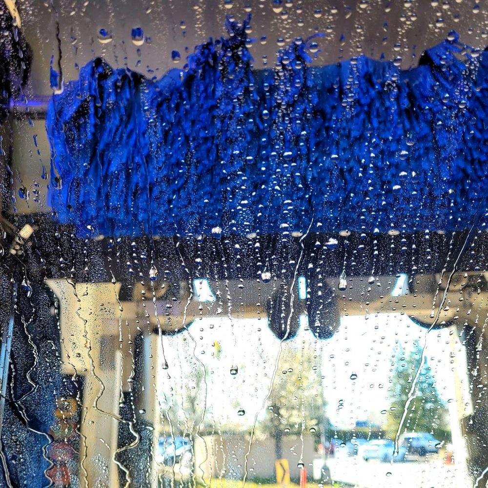 Chevron - a car in the rain through a window - Gas Stations Near Me - El Dorado Hills, California Chevron - a car in the rain through a window - Gas Stations Near Me - El Dorado Hills, California