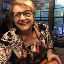 Annie Cares For SoCal - Carving a turkey in the kitchen.  Who wouldn't have a smile on their face!