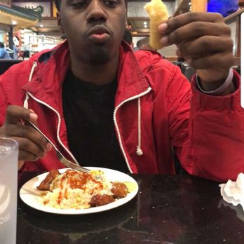Asian Buffet & Grill - A live shot my me eating a amazing mozzarella stick that I previously posted about in the review. love at first bite - Buffets Near Me - Matthews, North Carolina
