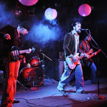 Jet Lounge - a group of musicians performing on stage - Lounges Near Me - Houston, Texas