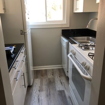 Hyper Tubs Refinishing - Painted kitchen, recaulked granite, spruced up cabinets, put in new floor. Amazing! - Painters Near Me