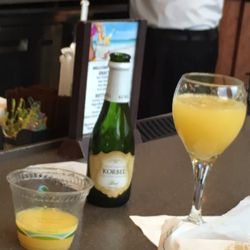 Facades Bar - Very nice they give you a cup of orange juice and a split of champagne to create your own proportions. Love it!