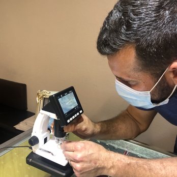 Just Bands - Raffi showing us the GIA inscription on the diamond - Jewelry Near Me - San Francisco, California