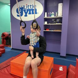 The Little Gym of West Seattle - Trying out the rings with the always lovely Teacher Dillon