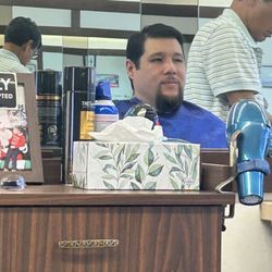 George's Barber & Hair Styling Salon - The gentlemen is getting a haircut