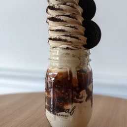 Thai tea ice cream with Oreos and chocolate drizzle Thai tea ice cream with Oreos and chocolate drizzle