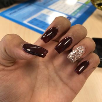 Spa Nails - I just have to say that they are very lumpy  and as you can see the woman that did my nails cut some places around my finger. - Nail Salons Near Me - Delano, California